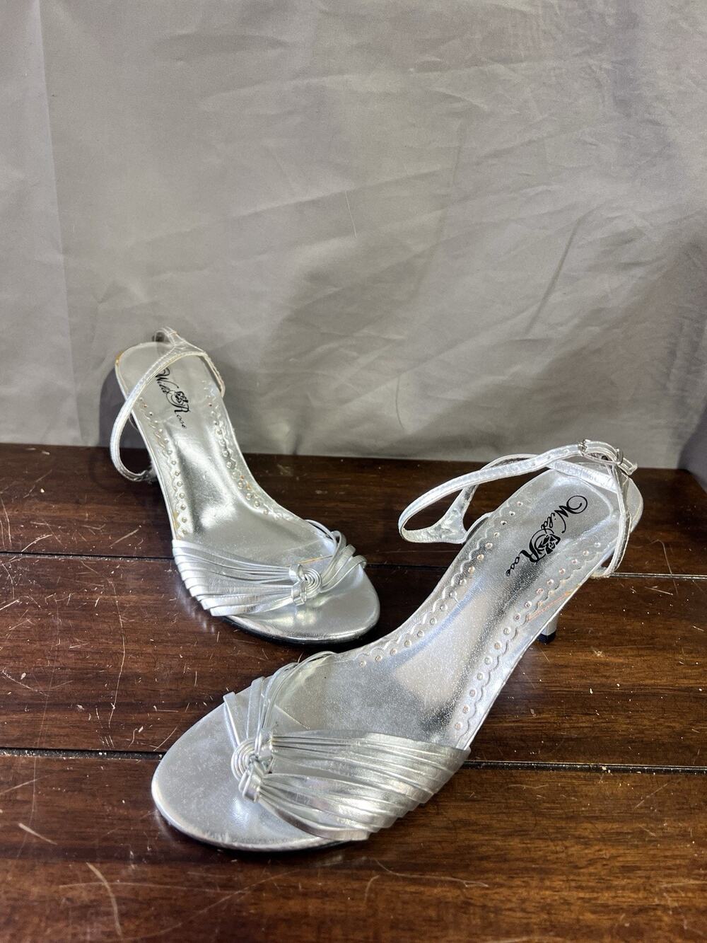 silver, strappy, low-wedge sandals are by the brand Wild Rise Size 9 TG2031